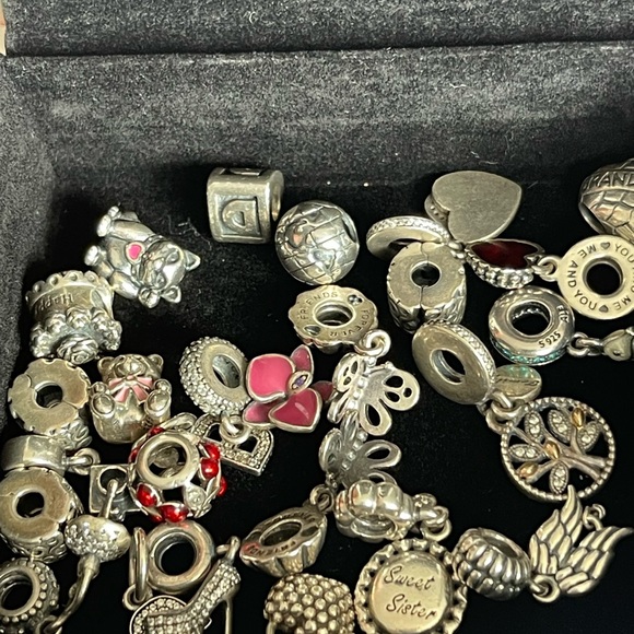 Lot of 26 Authentic Pandora charms.